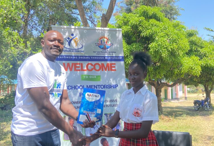 Gifting students study materials at Kikubi Girls